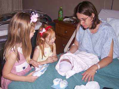 Proud sisters and Mommy!